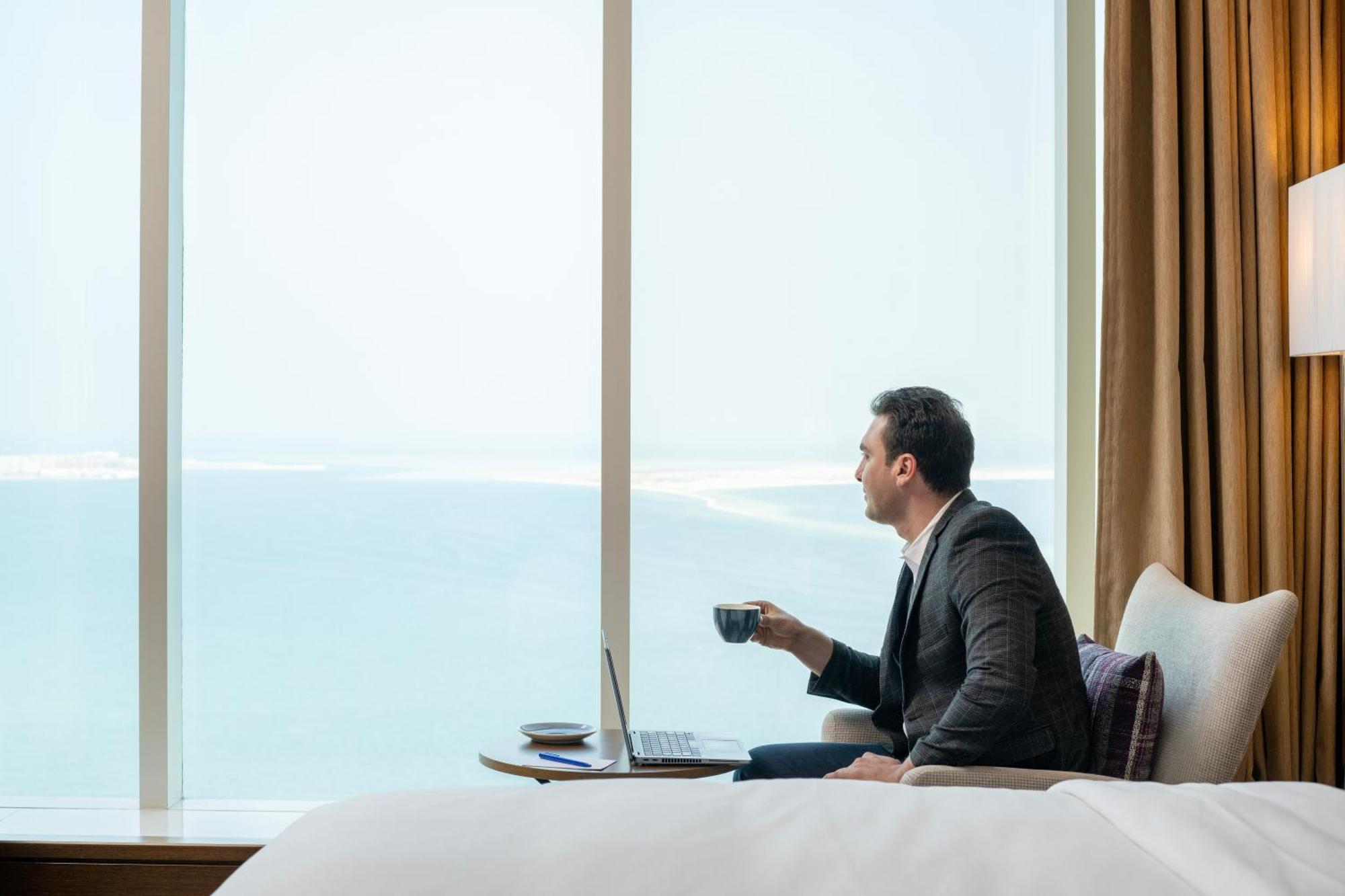 Delta Hotels By Marriott City Center Doha Eksteriør billede A guest enjoying the view from a room at the hotel